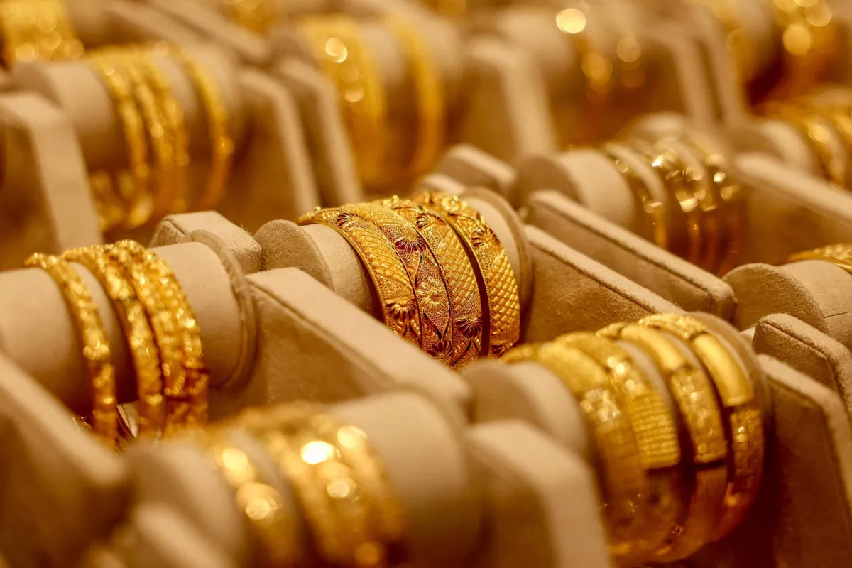 Gold Eases on Higher Yields Firm Dollar; USIran Talks in Focus
