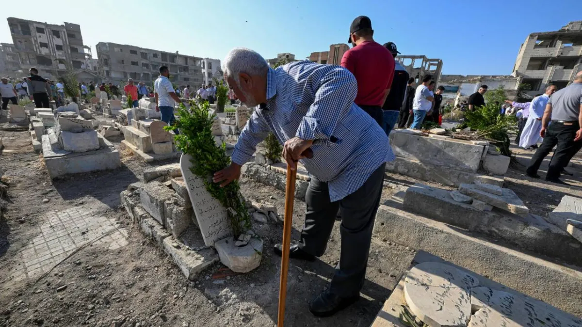 In Syrias Devastated Jobar Cemetery Comes Alive for Eid020 In Syrias Devastated Jobar Cemetery Comes Alive for Eid